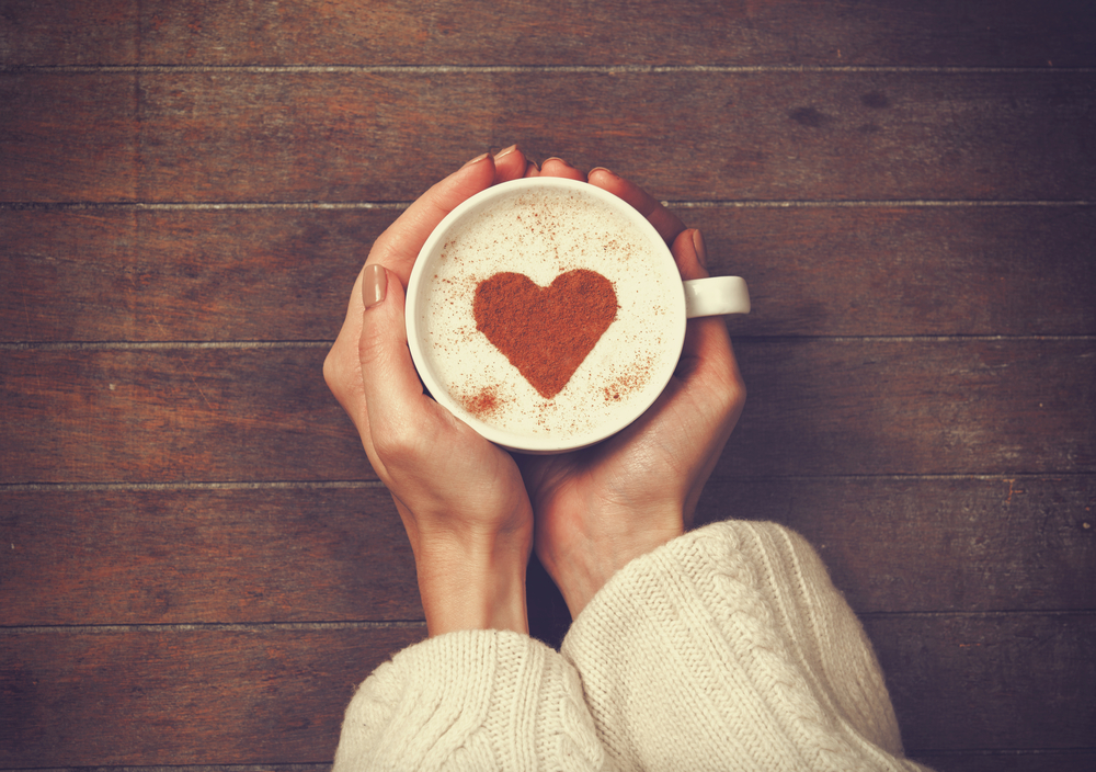 Woman,Holding,Hot,Cup,Of,Coffee,,With,Heart,Shape